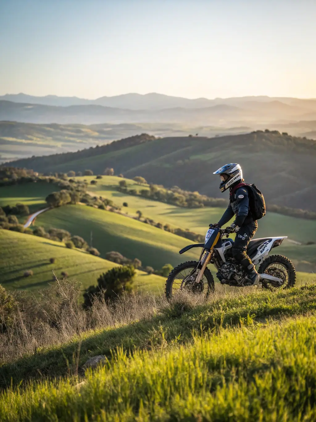 A young rider skillfully navigating a motocross track on a sunny day at the Bel-Air circuit, showcasing the club's youth training program.